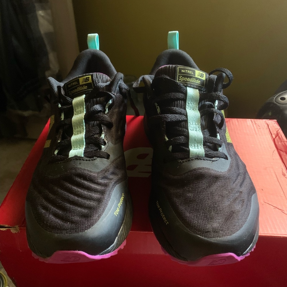 A pair of New Balance trail running sneakers, size 7 1/2